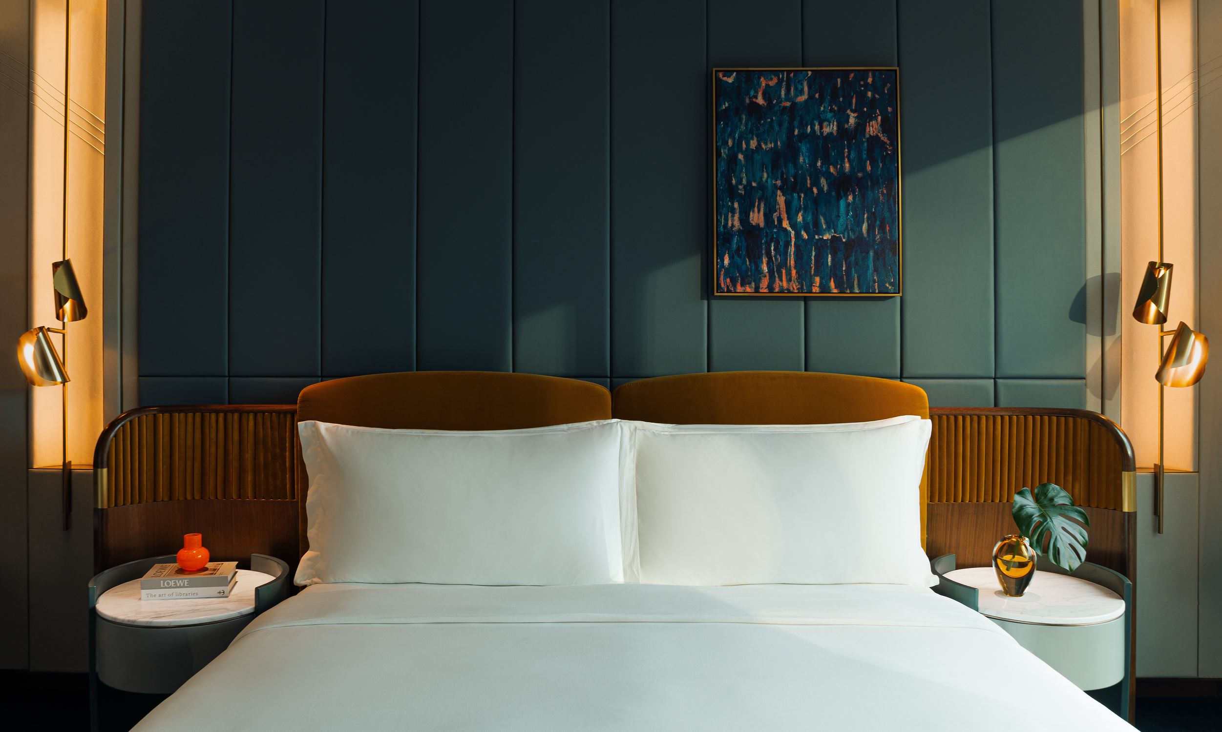 Comfortable, white bed in a Kimpton Naluria Kuala Lumpur suite room